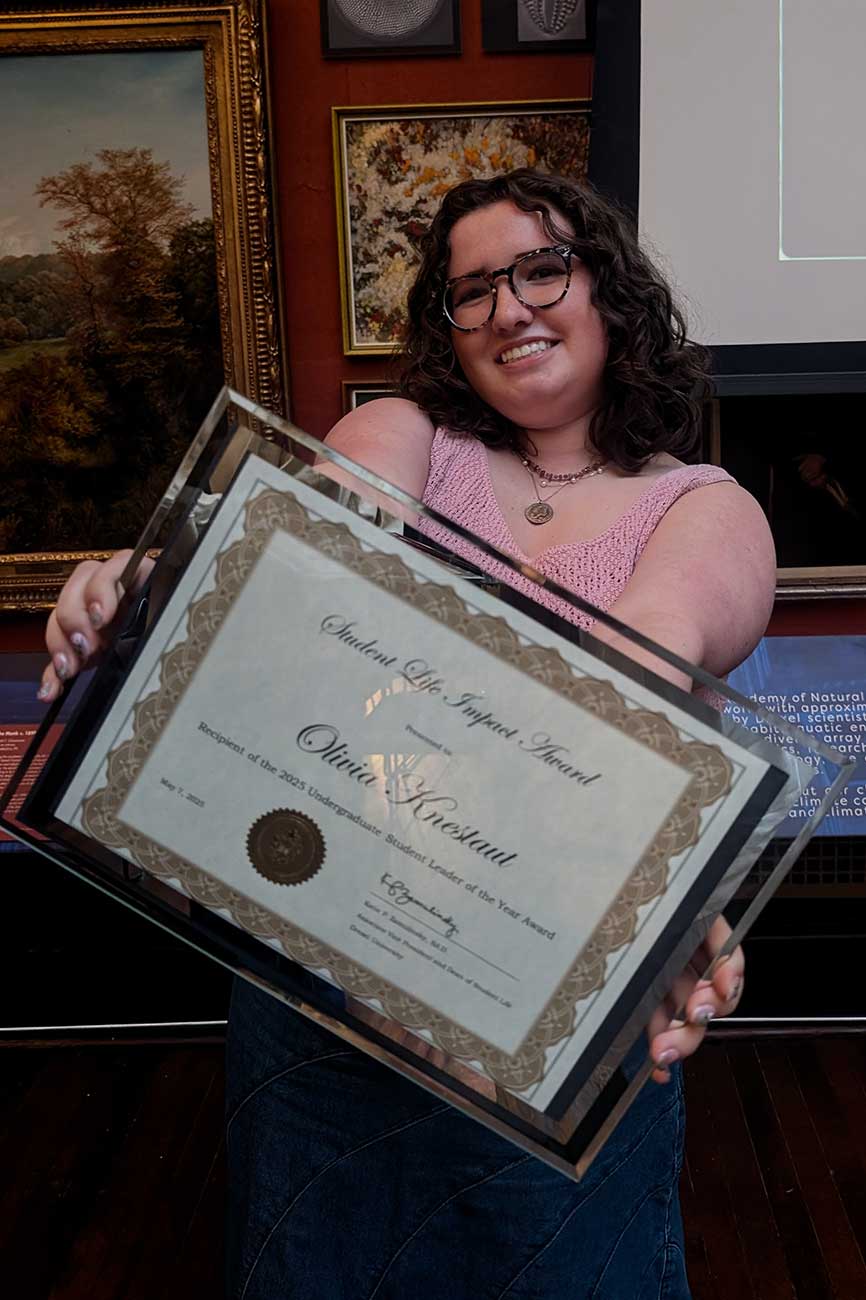 Olivia with her undergraduate student leader of the year award