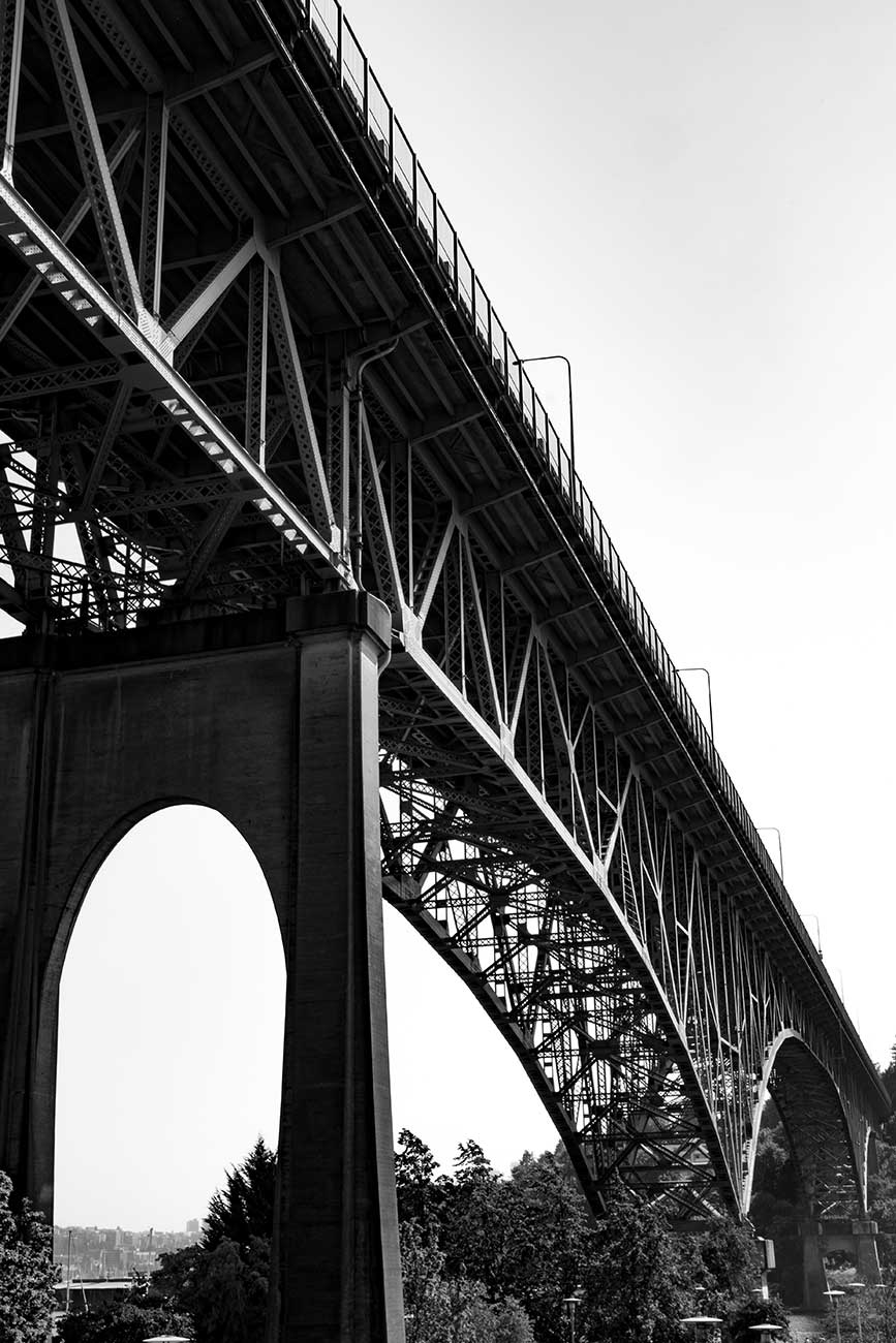 Black and white Aurora Bridge high in the sky over Fremont, Seattle, Washington