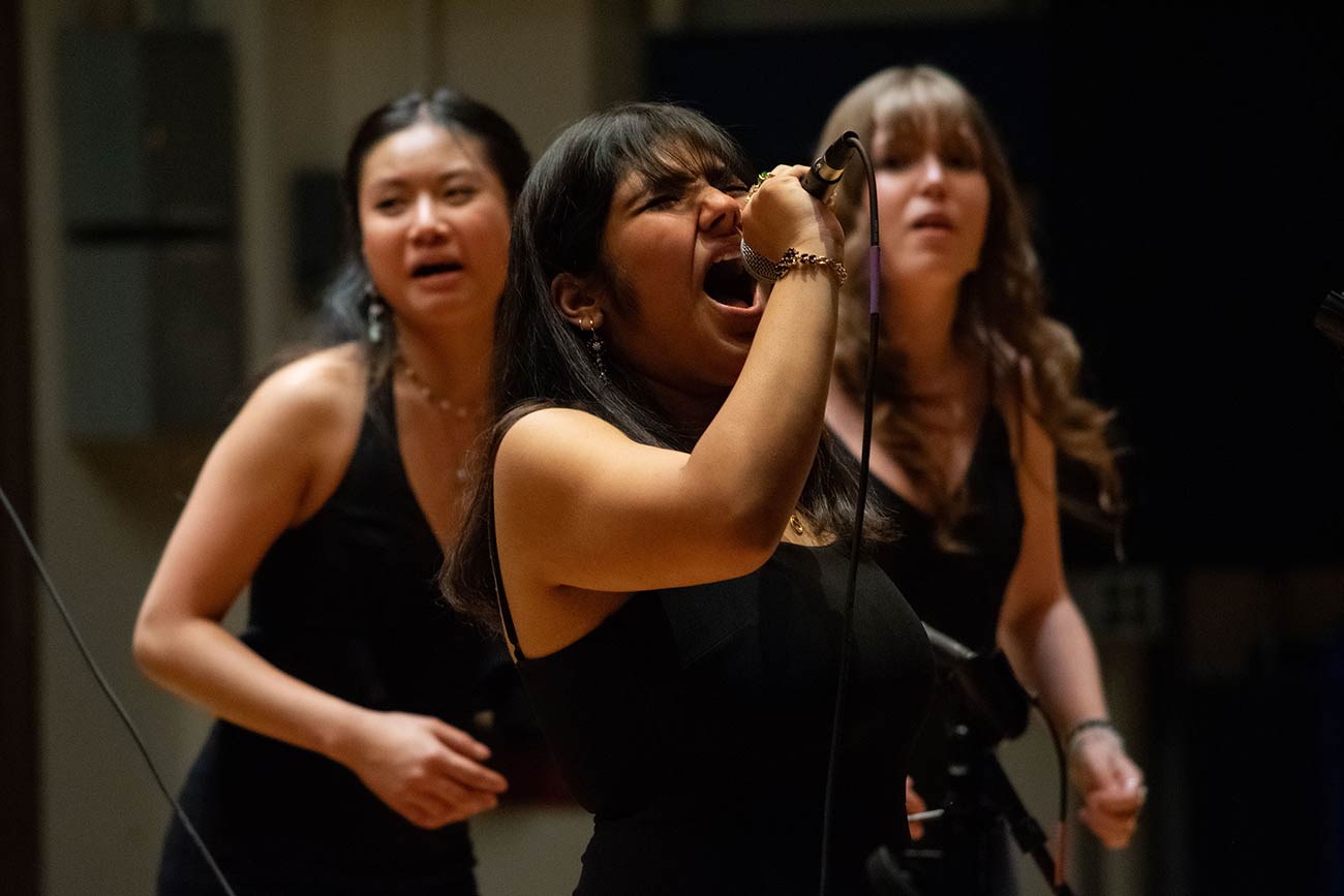 Drexel treblemaker's soloist belting into the microphone