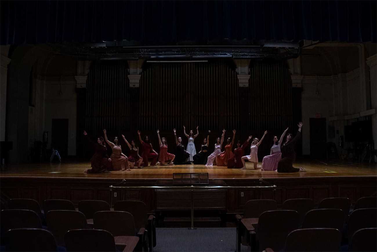 Shot down theater with Drexel University Treblemakers acapella group girls performing together on stage